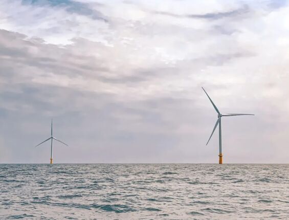 two wind turbines in the ocean